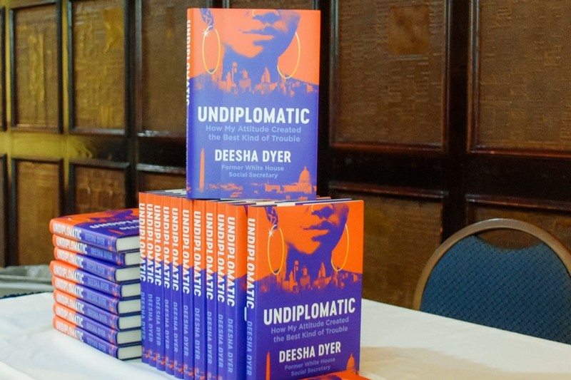 Photo of stack of Deesha Dyer's book 'Undiplomatic: How My Attitude Created the Best Kind of Trouble'