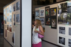 NPC Member Kerry McKenney enjoys the photographs during the September 2, 2010 11th Annual Members' Photography Exhibit.