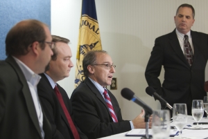Washington Post writer and editor Richard Leiby (third from left) discusses the dangers faced by journalists covering conflicts in Pakistan and Mexico at a National Press Club Freedom of the Press event on Nov. 17. Malcolm Beith (first from left) and Patrick Ventrell (second from left) also participated. The event was moderated by Club President and panel moderator Mark Hamrick (standing).