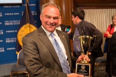 Winner of the 'Best Speller in The United States' award, Sen. Tim Kaine celebrates at the NPC Centennial Spelling Bee on Sept. 18, 2013.