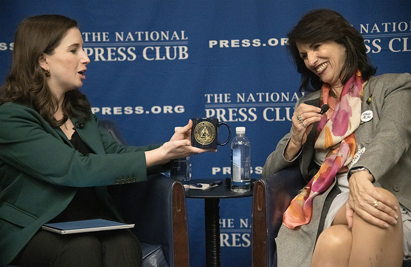 Emily Wilkins, president of the National Press Club, presents Diane Foley with a souvenir Press Club mug. Photo: Peter West