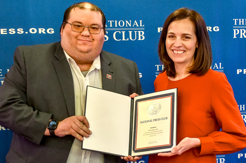 National Press Club president Mike Balsamo presents this year's Cosgrove award to former NPC president Jen Judson. Photo by Alan Kotok.