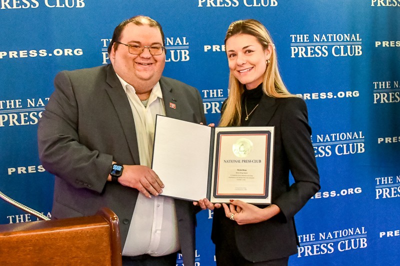 National Press Club president Mike Balsamo presents this year's Bernie Krug award to International Correspondents Team chair Nicola Wenz. Photo by Alan Kotok.