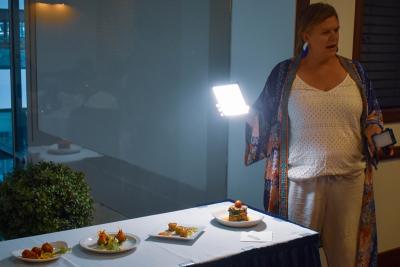 Jennifer Chase uses a portable lighting device during her talk.