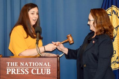 Jen Judson passes gavel to Eileen O'Reilly