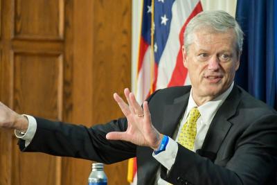 NCAA President Charlie Baker assumes Heisman Trophy stance