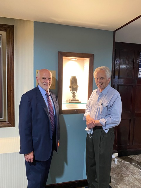 Former NPC president Michael Freedman poses with Casey Murrow in front of Edward R. Murrow's iconic microphone. Photo: Bob Ludwig.
