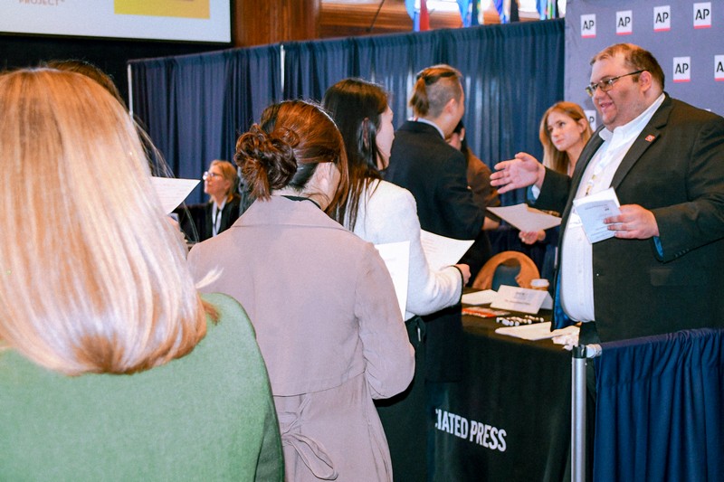 Photo of Mike Balsamo at AP table at Career Day.