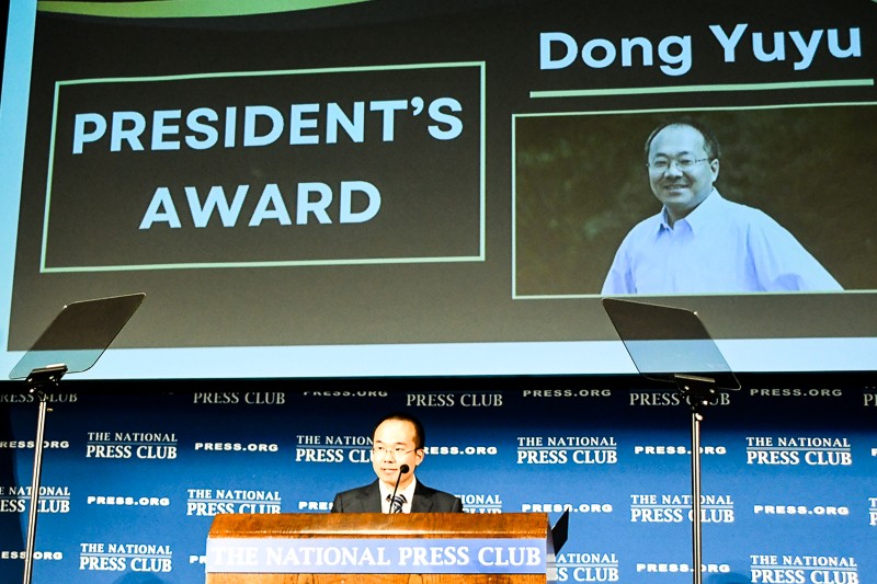 Dong Yifu accepts Club President's Award on behalf of his father, Dong YuYu