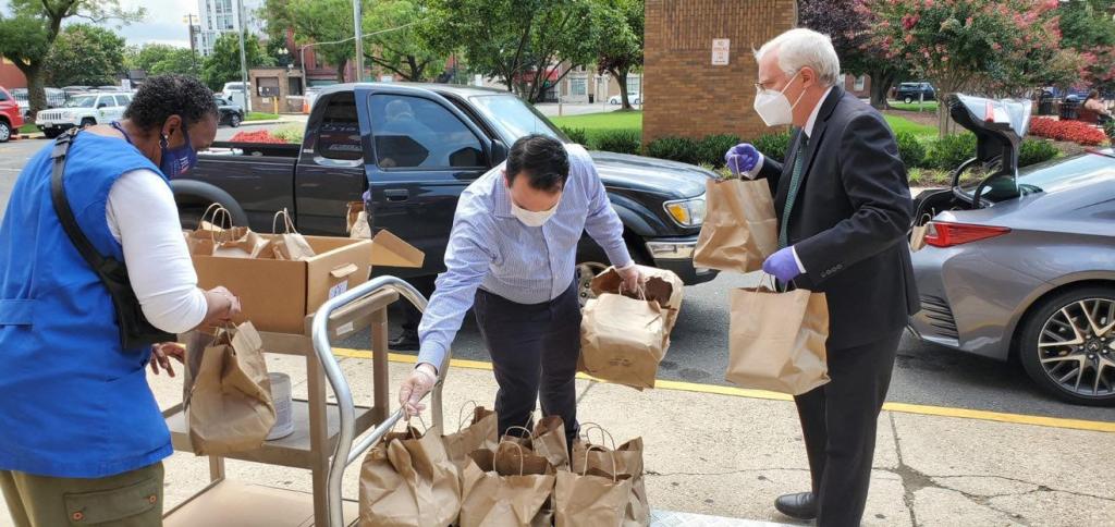 Photo of Club staff delivering meals