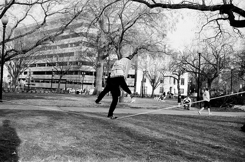 Photo of tight rope walker in Dupont Circle that will be part of NPC Photo Exhibit