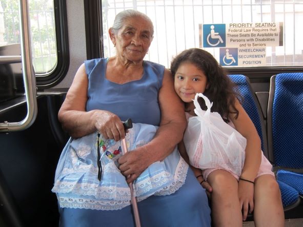 Photo of grandmother and granddaughter on D.C. bus.