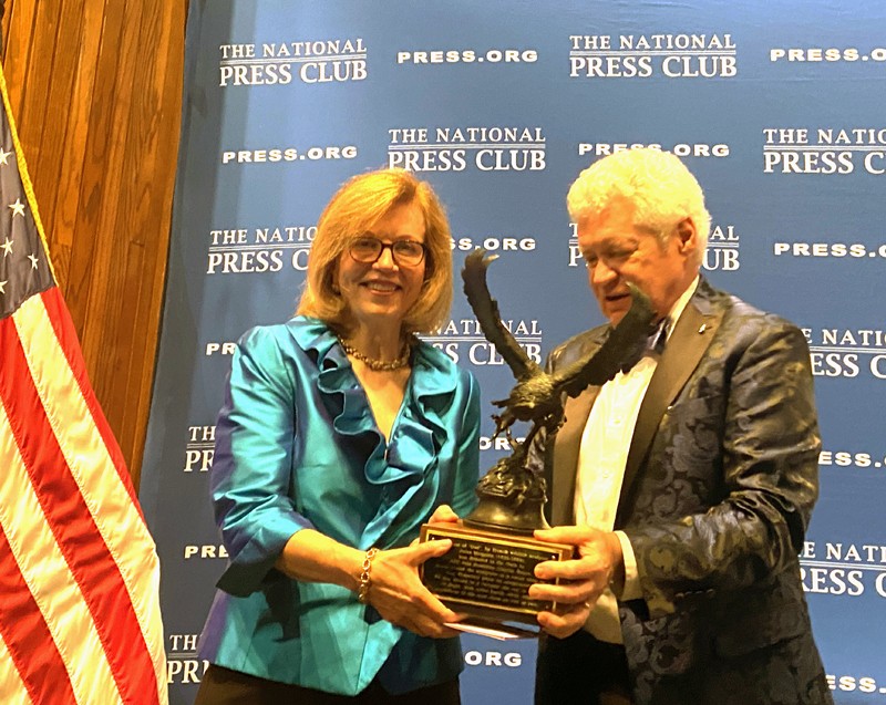 Photo of Susan Page receiving Order of the Owl from Rod Kuckro