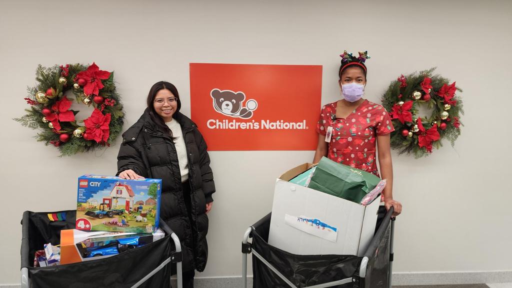 Photo of Club staffer delivering toys to National Children's Hospital