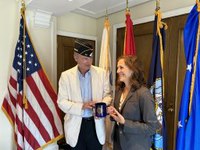Photo of Marine Corps public affairs director Aprl Langwell and Post 20 Director Tom Young