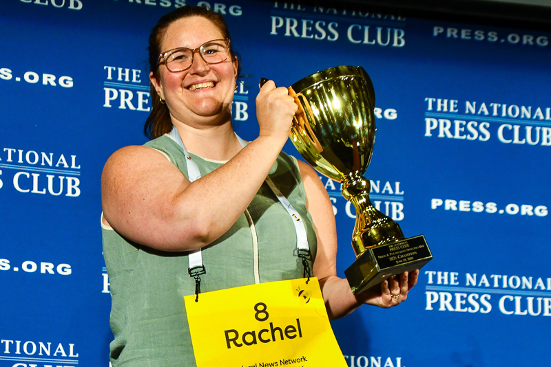 woman holding up a trophy